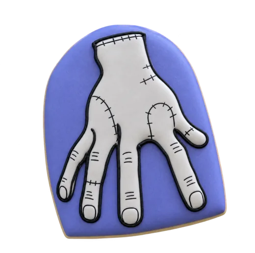 Lavender Halloween cookie with an illustrated hand