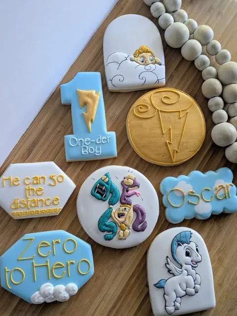 Zero to Hero first birthday cookies with Pegasus and a gold medal